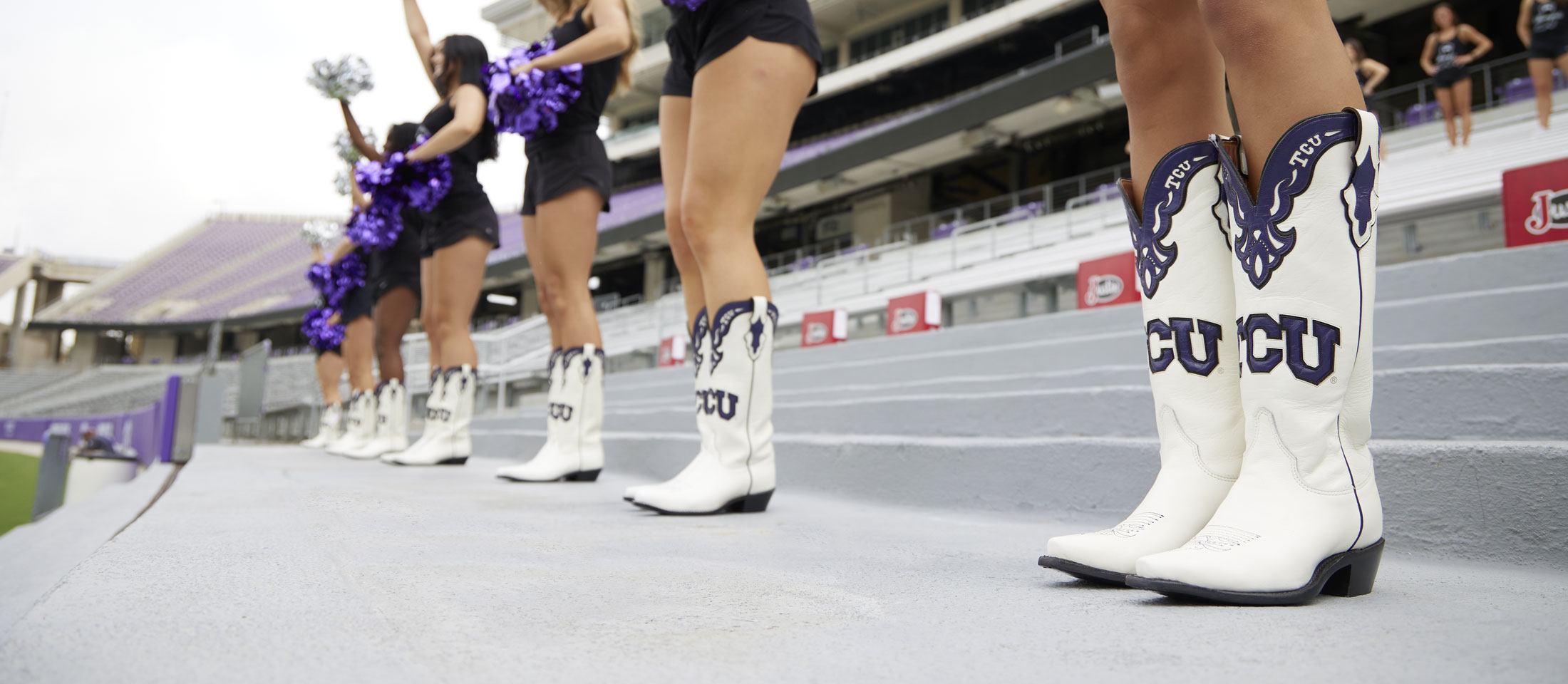 The Texas Christian University Show Girls Pose with their Justin Boots.